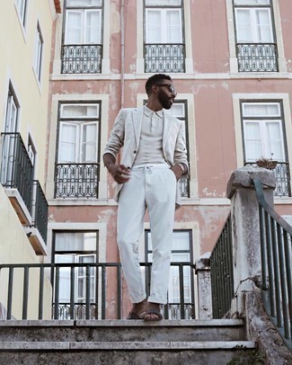 Beige Blazer Outfits For Men: A beige blazer and white chinos matched together are a sartorial dream for men who love polished styles. Finishing off with dark brown leather sandals is an easy way to bring a mellow vibe to this look.