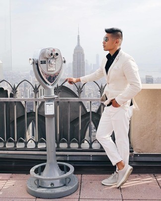 White Jeans Outfits For Men: This combination of a beige blazer and white jeans is hard proof that a safe look doesn't have to be boring. Infuse a carefree vibe into this look by sporting grey leather low top sneakers.