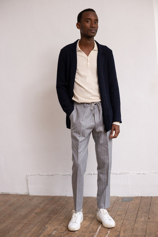 Grey Vertical Striped Chinos Outfits: For a casually dapper getup, consider teaming a navy knit blazer with grey vertical striped chinos — these items go perfectly well together. For a more relaxed twist, why not introduce white leather low top sneakers to the equation?