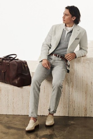 500+ Fall Outfits For Men: Why not choose a grey vertical striped blazer and grey jeans? As well as super practical, both items look cool together. Feeling transgressive? Switch things up by finishing off with beige suede loafers. As you can see here, it's very easy to look dapper and stay warm when chillier weather arrives, thanks to this look.