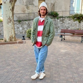 White Horizontal Striped Polo Neck Sweater Outfits For Men: For a classic and casual menswear style, make a white horizontal striped polo neck sweater and light blue jeans your outfit choice — these two pieces work perfectly well together. Complement this getup with a pair of white canvas low top sneakers to instantly dial up the cool of this look.