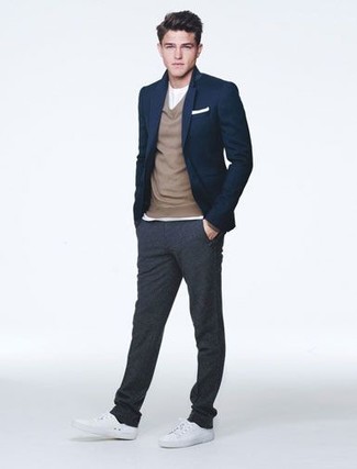Grey Sweatpants Outfits For Men: This on-trend look is easy to break down: a navy blazer and grey sweatpants. The whole getup comes together perfectly when you complete your ensemble with white low top sneakers.