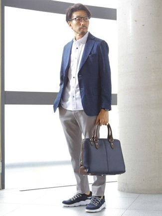Navy Blazer Outfits For Men: Try teaming a navy blazer with grey chinos for a neat polished ensemble. Put a dressed-down spin on your outfit by slipping into navy and white athletic shoes.