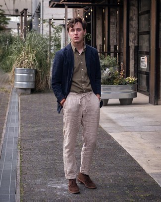 Navy Linen Blazer Outfits For Men: This smart casual pairing of a navy linen blazer and beige linen chinos is capable of taking on different forms depending on the way it's styled. A pair of dark brown suede desert boots is a good option to round off your outfit.