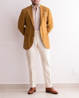 Brown Leather Brogues Outfits: Marrying a tobacco blazer and white dress pants will cement your expert styling. A pair of brown leather brogues adds edginess to this outfit.