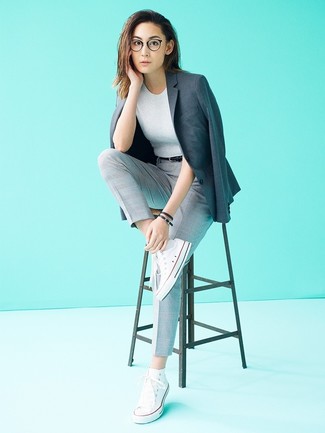 Charcoal Blazer Outfits For Women: A charcoal blazer and grey check tapered pants are a pairing that every cool girl should have in her casual fashion mix. Want to tone it down in the footwear department? Complete your look with a pair of white canvas high top sneakers for the day.