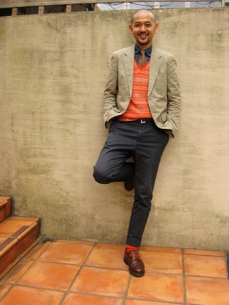 Orange Fair Isle Sweater Vest Outfits For Men: Go for an orange fair isle sweater vest and charcoal chinos for effortless sophistication with a masculine spin. If you need to effortlessly step up this outfit with footwear, why not add brown leather derby shoes to the equation?