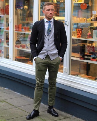 Charcoal Sweater Vest Outfits For Men: A charcoal sweater vest and olive chinos worn together are a sartorial dream for those dressers who prefer casually sleek styles. If you need to effortlessly dress up this outfit with shoes, complete your getup with a pair of black leather tassel loafers.