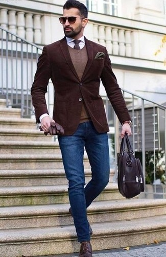 Dark Brown Sweater Vest Outfits For Men: This pairing of a dark brown sweater vest and blue jeans makes for the perfect base for an outfit. Elevate your ensemble with the help of dark purple leather derby shoes.