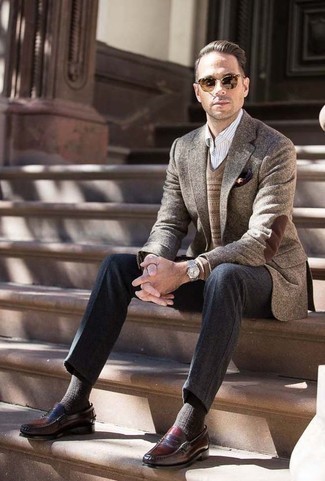 Dark Brown Sweater Vest Outfits For Men: Putting together a dark brown sweater vest and charcoal wool dress pants is a guaranteed way to breathe a sophisticated touch into your styling arsenal. Go ahead and complement this look with burgundy leather loafers for a more relaxed touch.
