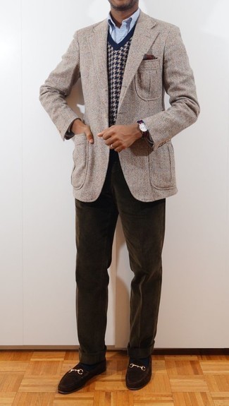 Blue Sweater Vest Outfits For Men: If the occasion calls for an elegant yet knockout getup, you can easily dress in a blue sweater vest and dark brown corduroy chinos. Serve a little outfit-mixing magic by finishing off with a pair of dark brown suede loafers.