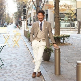 Beige Sweater Vest Outfits For Men: Teaming a beige sweater vest with white dress pants is an amazing idea for a dapper and classy look. Clueless about how to finish off? Complete your outfit with a pair of brown suede double monks to change things up a bit.