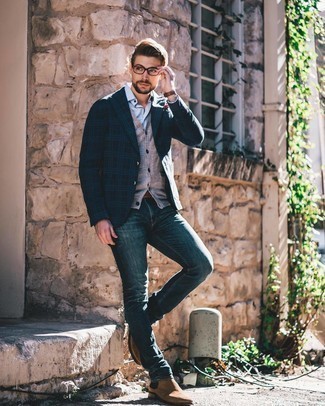 Grey Sweater Vest Outfits For Men: A grey sweater vest and navy jeans are among those versatile pieces that have become the crucial elements in any modern gentleman's sartorial arsenal. Let your outfit coordination expertise really shine by finishing this ensemble with a pair of brown suede chelsea boots.