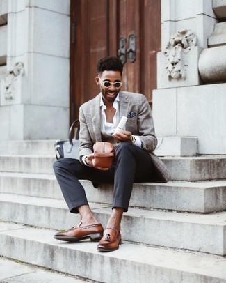 Grey Sweater Vest Outfits For Men: Definitive proof that a grey sweater vest and charcoal dress pants look amazing when teamed together in an elegant ensemble for a modern gentleman. To inject a more laid-back twist into this look, complete your look with a pair of brown leather tassel loafers.