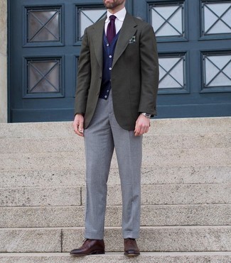 Dark Green Wool Blazer Outfits For Men: Marry a dark green wool blazer with grey dress pants to look like a true style connoisseur. When not sure as to the footwear, add a pair of dark brown leather oxford shoes to your getup.