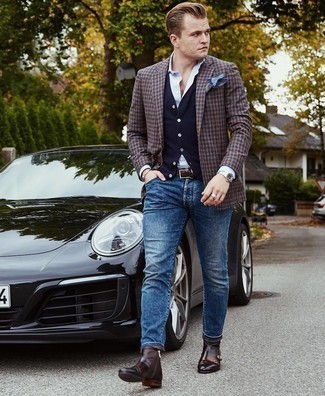 Navy Sweater Vest Outfits For Men: Prove that nobody does smart menswear quite like you do by wearing a navy sweater vest and blue jeans. To introduce a little zing to your ensemble, complete this getup with dark brown leather chelsea boots.