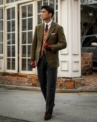 Brown Sweater Vest Outfits For Men: Putting together a brown sweater vest with charcoal dress pants is an on-point pick for a classic and elegant ensemble. Dial up the cool of your ensemble by wearing a pair of dark brown suede desert boots.