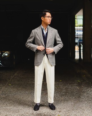 Men's Outfits 2021: This outfit suggests it pays to invest in such smart menswear items as a grey wool blazer and white dress pants. A pair of black suede loafers looks perfectly at home teamed with this look.