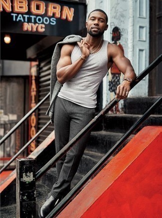 Grey Tank Outfits For Men: This combo of a grey tank and charcoal dress pants couldn't possibly come across other than seriously dapper and casually neat. Avoid looking too casual by finishing off with black leather chelsea boots.