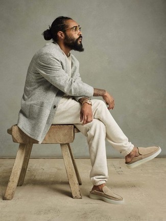500+ Summer Outfits For Men: The versatility of a grey knit blazer and a white track suit means you'll always have them on heavy rotation. If you want to easily rev up this outfit with one item, why not add a pair of beige suede loafers to the equation? Seeing as it's extremely hot outside, this ensemble appears perfect and entirely summer-friendly.