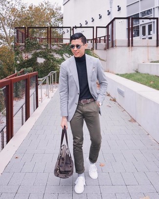 Charcoal Vertical Striped Blazer Outfits For Men: This is definitive proof that a charcoal vertical striped blazer and brown chinos look amazing when worn together. Up your getup by slipping into white canvas low top sneakers.