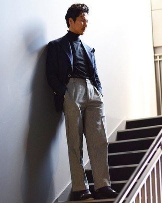Navy Turtleneck Outfits For Men: This classy pairing of a navy turtleneck and grey dress pants is a popular choice among the style-conscious guys. The whole ensemble comes together if you enter a pair of black suede loafers into the equation.