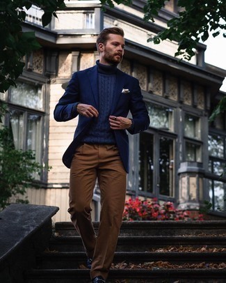Navy Knit Turtleneck Outfits For Men: We're loving how this combination of a navy knit turtleneck and brown dress pants instantly makes a man look polished and dapper. Add a pair of navy leather loafers to this ensemble to instantly spice up the look.