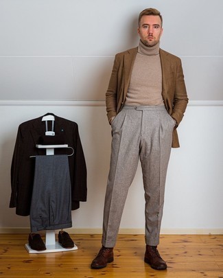 Tan Turtleneck Outfits For Men: This elegant combination of a tan turtleneck and grey dress pants will cement your outfit coordination prowess. Dark brown leather casual boots will add edginess to an otherwise sober ensemble.