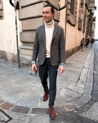 Navy Vertical Striped Dress Pants Outfits For Men: Opt for a charcoal houndstooth wool blazer and navy vertical striped dress pants for a proper elegant menswear style. For times when this ensemble looks all-too-classic, dial it down by finishing off with brown suede desert boots.