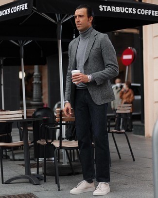 Grey Herringbone Wool Blazer with Navy Jeans Smart Casual Outfits For Men: This pairing of a grey herringbone wool blazer and navy jeans is definitive proof that a straightforward casual outfit can still be really interesting. For something more on the casually edgy end to round off your getup, add beige suede low top sneakers to the mix.