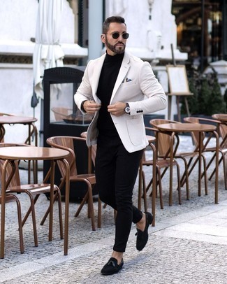White Blazer Outfits For Men: If the setting permits relaxed casual dressing, try teaming a white blazer with black skinny jeans. You can get a little creative with footwear and lift up this ensemble by rocking black suede tassel loafers.