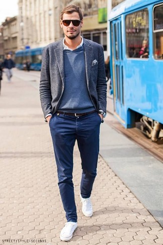 When the occasion calls for an effortlessly smart ensemble, pair a grey wool blazer with navy chinos. Add a pair of white low top sneakers to your ensemble to make a sober ensemble feel suddenly fresh.