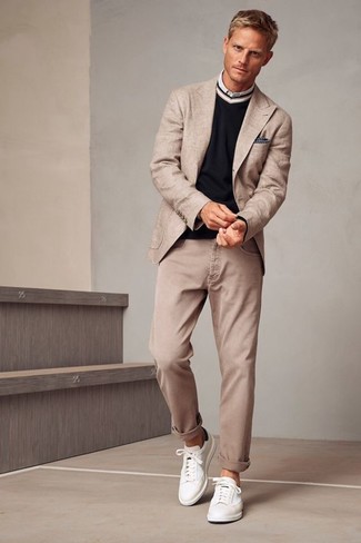 If the occasion calls for an elegant yet neat outfit, you can easily go for a beige blazer and beige jeans. White leather low top sneakers will bring a laid-back touch to an otherwise mostly dressed-up look.
