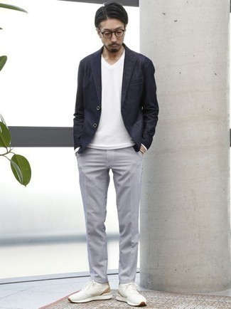 Charcoal Vertical Striped Chinos Outfits: This smart combo of a navy blazer and charcoal vertical striped chinos is very easy to throw together without a second thought, helping you look amazing and prepared for anything without spending too much time searching through your closet. Our favorite of an infinite number of ways to finish this look is a pair of white athletic shoes.
