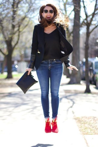 Red Athletic Shoes Outfits For Women: This casual combo of a black blazer and blue skinny jeans is a fail-safe option when you need to look nice but have no time to pull together an outfit. Red athletic shoes will add a mellow vibe to an otherwise sober outfit.
