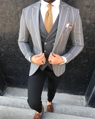 Grey Waistcoat Outfits: For a look that's classy and Bond-worthy, pair a grey waistcoat with black chinos. Now all you need is a cool pair of brown suede tassel loafers.