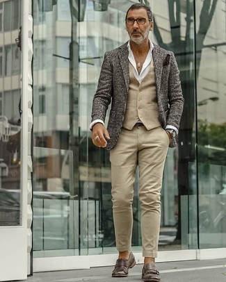 Dark Brown Fringe Leather Loafers Outfits For Men: This combo of a dark brown houndstooth wool blazer and khaki chinos looks polished, but in a modern way. Why not introduce dark brown fringe leather loafers to your outfit for an added touch of style?