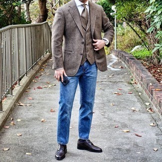 Brown Waistcoat Outfits: You're looking at the solid proof that a brown waistcoat and blue jeans look awesome if you wear them together in a sophisticated ensemble for a modern gentleman. Hesitant about how to finish this outfit? Rock a pair of dark brown leather derby shoes to amp it up a notch.