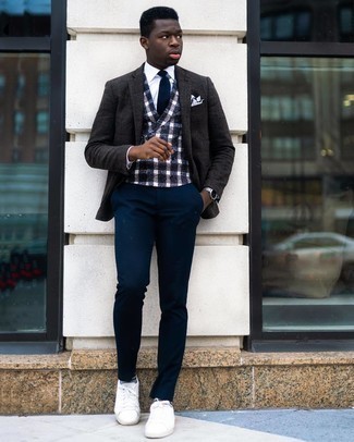 Charcoal Wool Blazer Outfits For Men: This combination of a charcoal wool blazer and navy chinos is a must-try effortlessly classic ensemble for today's gentleman. A pair of white canvas low top sneakers adds a whole new dimension to an otherwise mostly dressed-up ensemble.