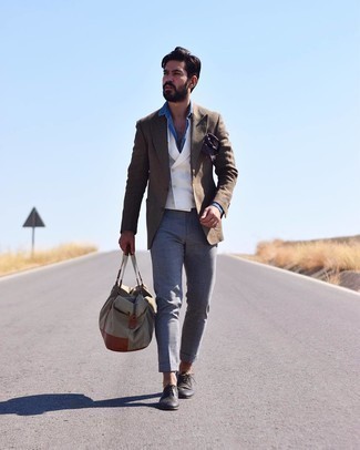 White and Navy Waistcoat Outfits: This combination of a white and navy waistcoat and grey chinos is a real life saver when you need to look truly elegant. The whole look comes together when you introduce a pair of black leather brogues to the mix.
