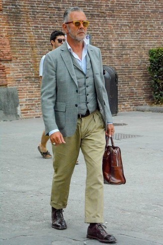 Brown Leather Briefcase Outfits: Prove that you do off-duty like a pro by opting for a grey blazer and a brown leather briefcase. To add some extra flair to this look, introduce a pair of burgundy leather oxford shoes to the equation.