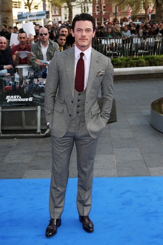 Luke Evans wearing Grey Blazer, Grey Waistcoat, White Dress Shirt, Grey Dress Pants