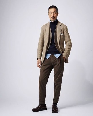 Tan Wool Blazer Outfits For Men: This combo of a tan wool blazer and dark brown chinos resonates masculine sophistication and effortless style. To give this look a classier finish, complement this look with dark brown leather derby shoes.