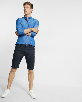 Black Denim Shorts Outfits For Men: Look dapper yet practical in a blue chambray long sleeve shirt and black denim shorts. Let your styling savvy truly shine by complementing your getup with a pair of white leather low top sneakers.