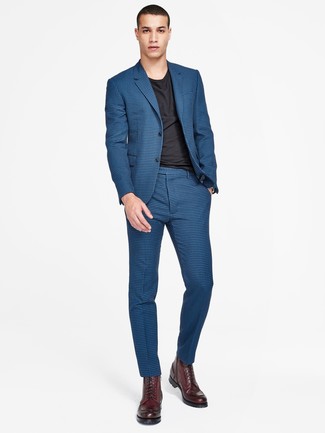 Navy Check Suit Outfits: Loving the way this smart combination of a navy check suit and a black crew-neck t-shirt instantly makes men look on-trend. Look at how great this ensemble goes with a pair of burgundy leather casual boots.