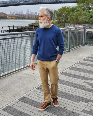 Men's Blue Crew-neck Sweater, Khaki Chinos, Brown Leather Low Top Sneakers, Dark Brown Horizontal Striped Watch