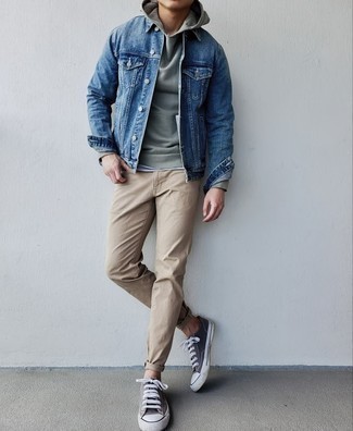 Charcoal Canvas Low Top Sneakers Outfits For Men: A blue denim jacket and khaki chinos are definitely worth being on your list of menswear staples. Charcoal canvas low top sneakers will bring a hint of stylish casualness to an otherwise all-too-safe ensemble.