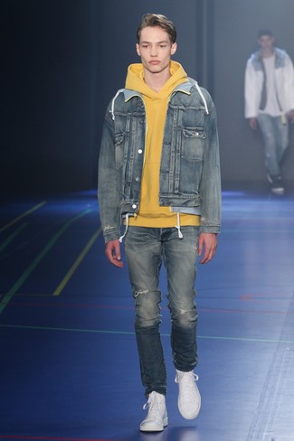 Mustard Hoodie Outfits For Men: For something on the cool and laid-back side, try pairing a mustard hoodie with blue ripped jeans. Introduce white leather high top sneakers to the mix and ta-da: the look is complete.