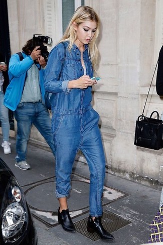 Blue Crossbody Bag Outfits: Pairing a blue denim jumpsuit with a blue crossbody bag is an on-point pick for a casually stylish outfit. Amp up the appeal of this outfit by sporting black leather ankle boots.