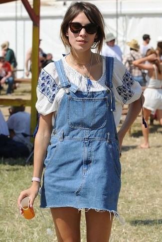 Alexa Chung wearing Blue Denim Overall Dress, White and Blue Embroidered Peasant Blouse, Blue Pendant